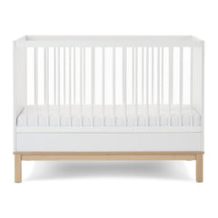 Obaby Astrid Mini Cot Bed - 120x60cm White - showing the cot with the mattress base at its lowest level