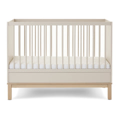 Obaby Astrid Mini Cot Bed - 120x60cm Satin - showing the cot with the mattress base at its lowest level