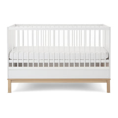 Obaby Astrid Cot Bed (140x70cm) - White - side view, shown with mattress base at lowest level