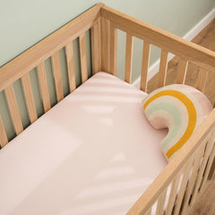 Clair De Lune Fitted Cot Bed Sheets (Pack of 2) - Pink - showing a sheet fitted to a cot bed mattress