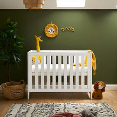 Obaby Nika MINI Cot Bed - White Wash lifestyle image of the mini cot