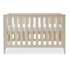 Obaby Nika Cot Bed (Oatmeal) - showing the cot with the mattress base and its highest level (mattress not included, available separately)