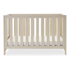 Obaby Nika Cot Bed (Oatmeal) - showing the cot with the mattress base at its lowest level (mattress not included, available separately)