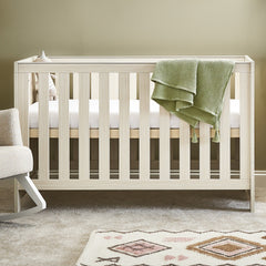 Obaby Nika Cot Bed (Oatmeal) - lifestyle image (mattress, bedding, accessories and chair not included)