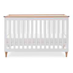 Obaby Orla Cot Bed - White with Oak - shown with mattress base at middle level