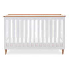 Obaby Orla Cot Bed - White with Oak - shown with mattress base at lowest level