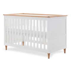 Obaby Orla Cot Bed - White with Oak - shown with mattress base at highest level