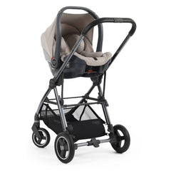 BabyStyle Oyster Capsule i-Size Infant Car Seat - Stone - showing the car seat fixed to the Gravity`s chassis